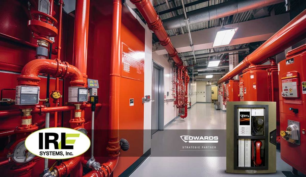 Fire safety system installation featuring red pipes and equipment, showcasing IRL Systems branding, emphasizing compliance with NYC fire safety regulations.